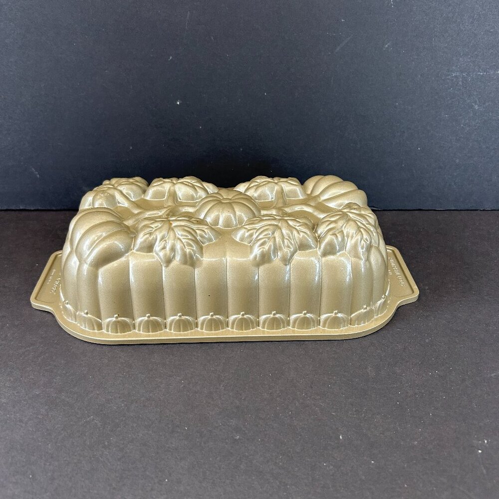 Nordic Ware Pumpkin Bread Loaf Pan featuring fall harvest pumpkins and leaves